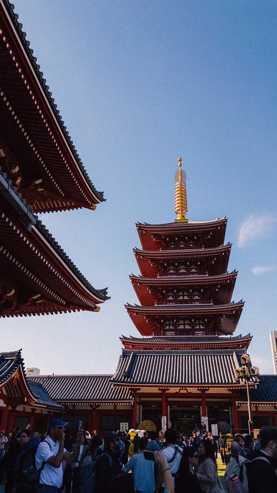 Capture of the iconic five-story pagoda at Senso-ji Temple with a clear blue sky in Tokyo, Japan.
